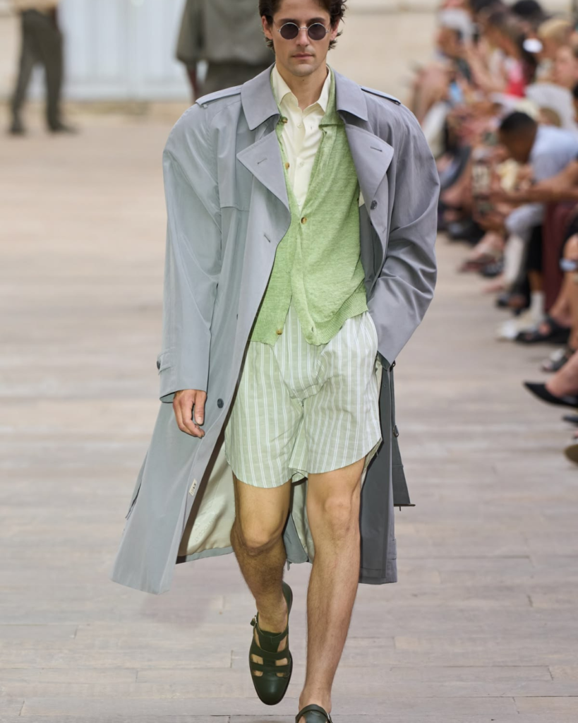 SOSHIOTSUKI SS27 Close-up of contemporary menswear tailoring showing textured fabrics, softened construction, and refined craftsmanship COAT OVER SHORTS AND SHIRT