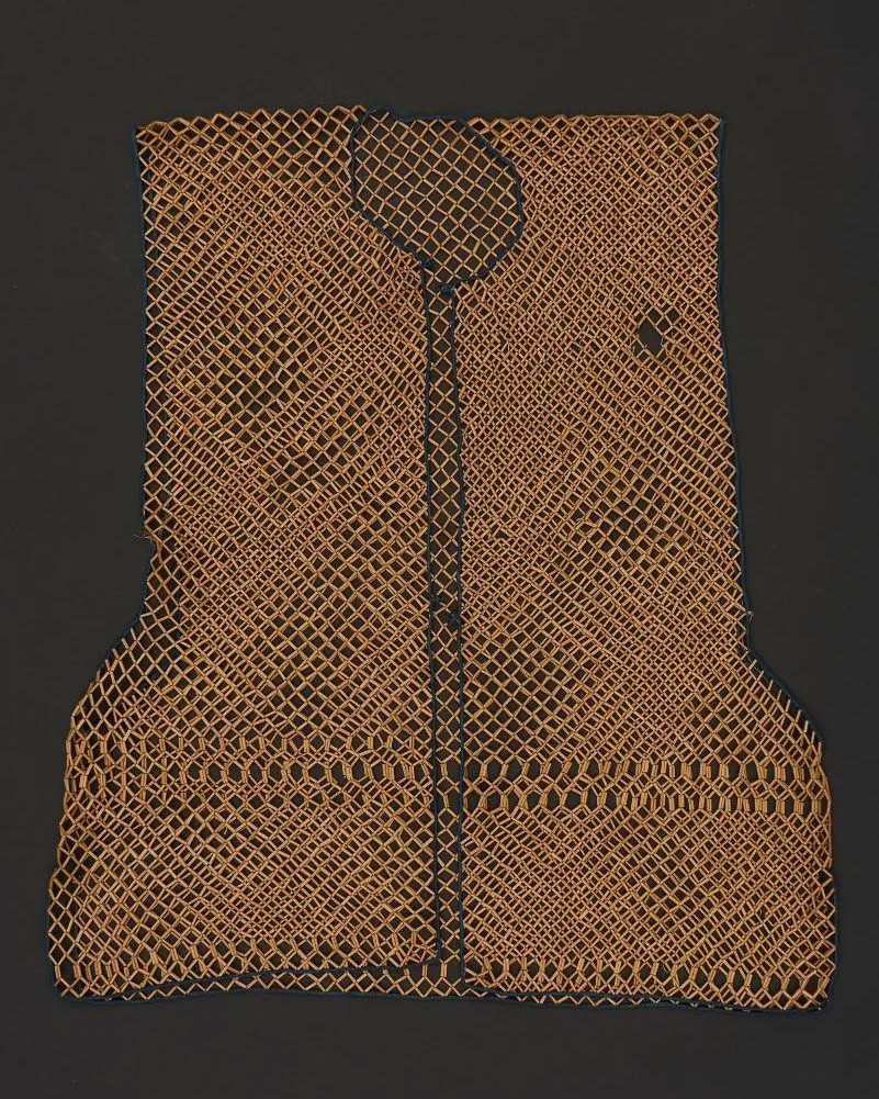 An old bamboo vest from China, found in Indonesia (1930 - 1940). Perenakan Museum.